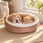 Senior dog resting in the soft round plush dog bed
